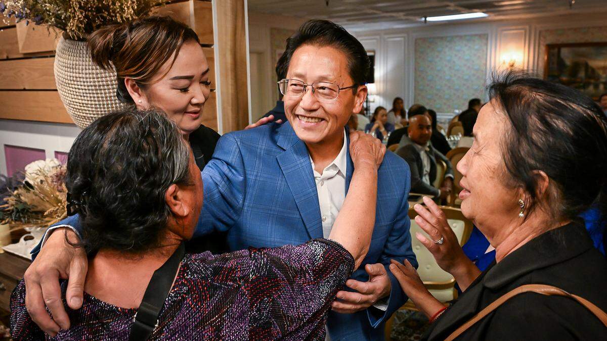 Brandon Vang, center, who currently sits on the Fresno City Council Council’s District 5, is congratulated by supporters after taking a lead in the June 2 election during an election night watch party at Chez Maryse in Fresno on Tuesday, June 2, 2026.