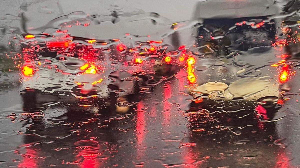 Cars wait at a traffic light during a downpour in southeast Fresno during a stormy day on Thursday, Jan 5, 2023.