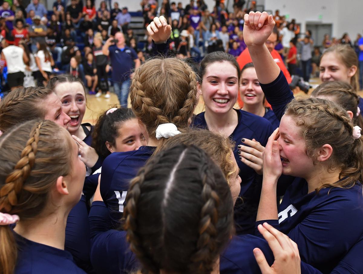 Yosemite High celebrates its championship win against Madera South at the Central Section girls volleyball championships held at College of the Sequoias on Saturday, Nov. 3, 2018 in Visalia.