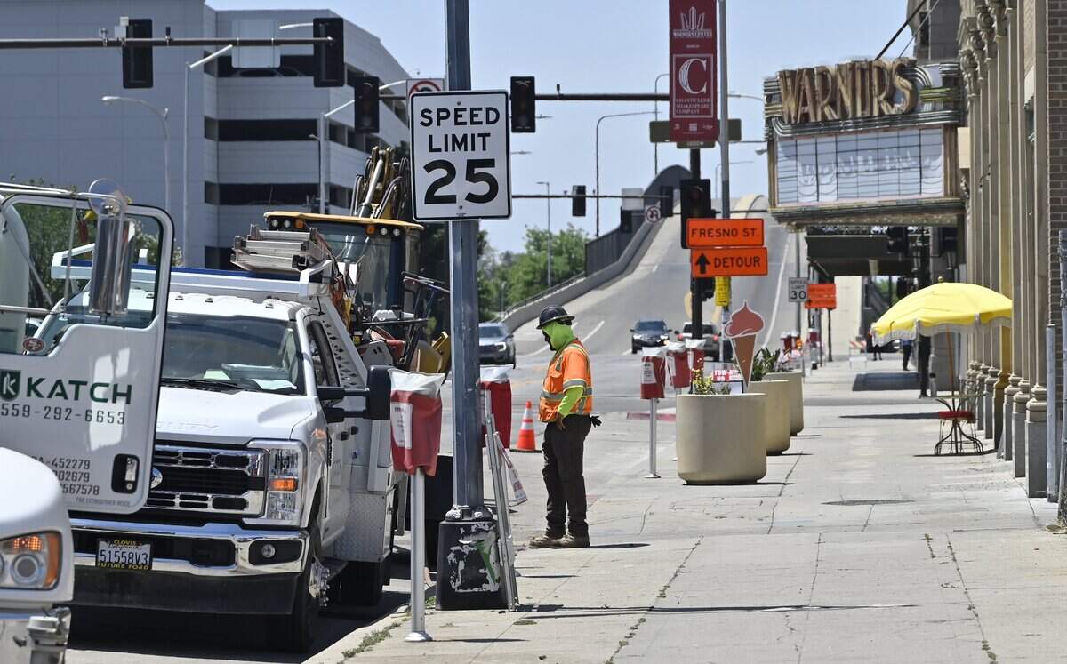 Road work is seen along Tuolumne Street where parking meters are covered in front of BB's Gelateria, just east of Fulton Street Tuesday, May 12, 2026 in downtown Fresno.