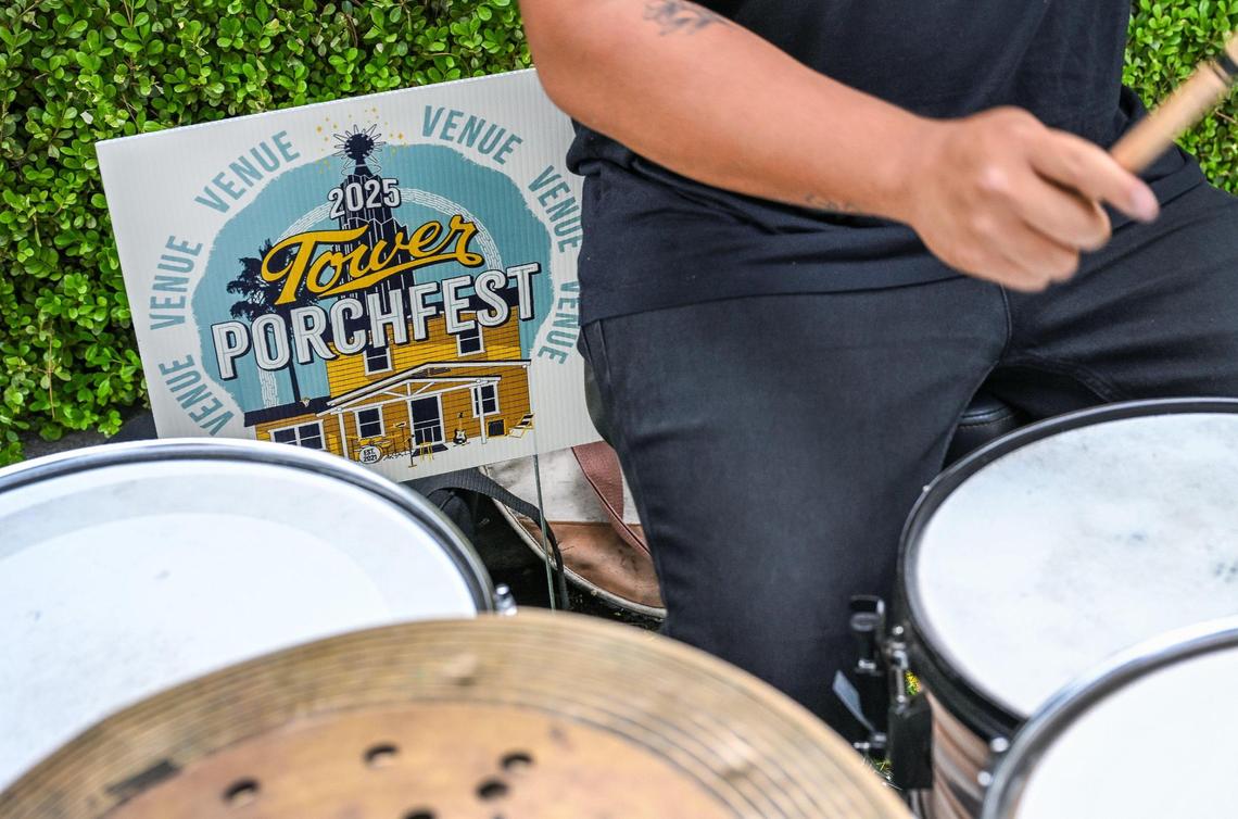 Vibe Check drummer Gene Abella plays as a Tower Portchfest sign stands behind him featuring the house that the band is playing in front of during a rehearsal on Thursday, April 17, 2025.
