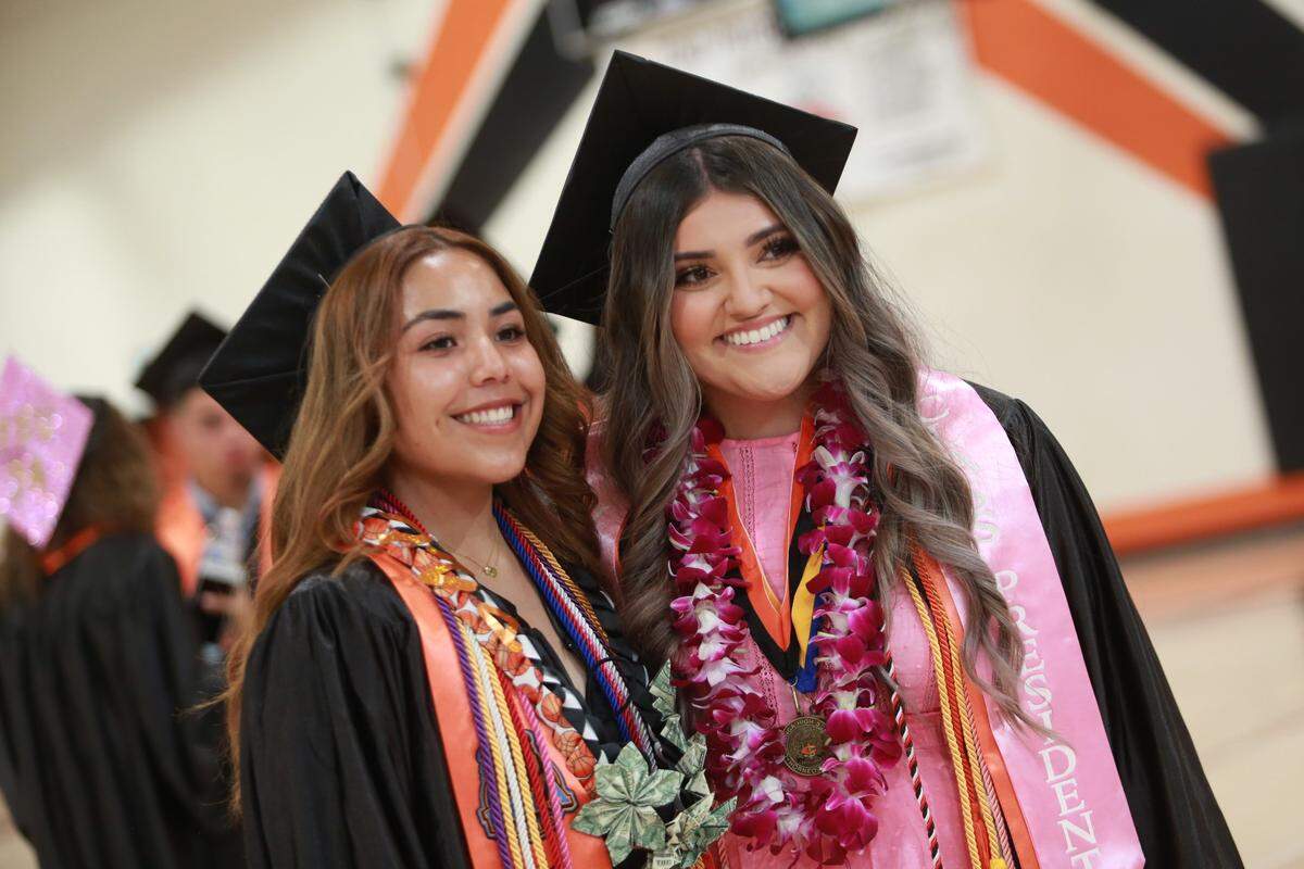 Coalinga High School valedictorians Luna Rodríguez and Frieda Hernández before the commencement ceremony at Chuck Garten Memorial Bowl on June 2.