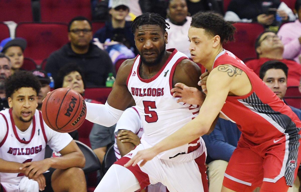 Fresno State’s Jordan Campbell, left, is fouled by New Mexico’s KJ Jenkins, right, Monday, Feb. 28, 2022 in Fresno.