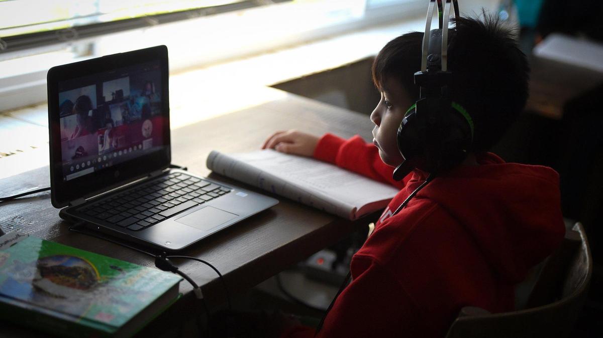 Thomas Elementary School 4th grader Dominick Pacheco joins in his class online as they distance learn from home, Thursday Oct. 29, 2020.