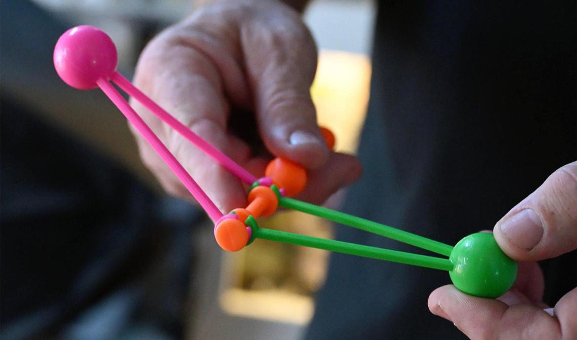 Fresno State physics professor Ray Hall uses a child’s “clacker” Newton’s Yo-Yo which he says demonstrates Newton’s Second and Third Laws of Motion. Photographed Thursday, June 5, 2025 in Fresno.
