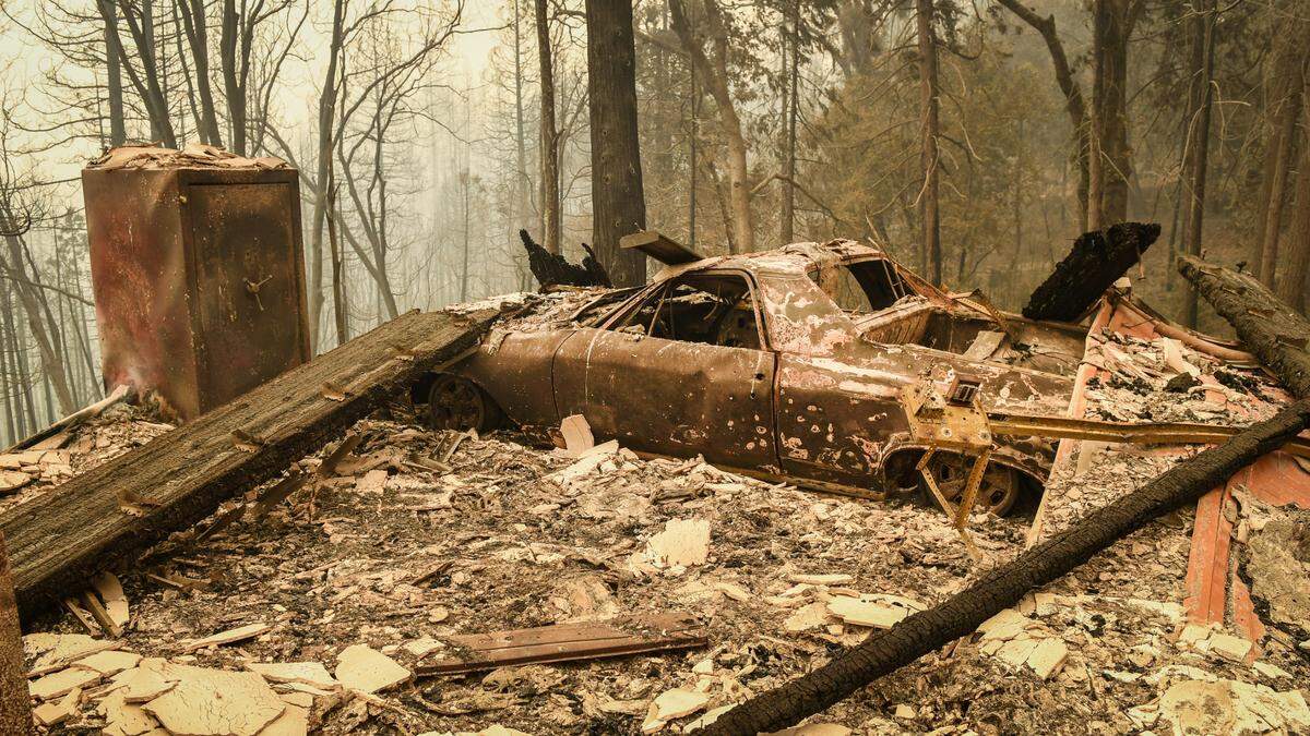 A charred car appears at a home destroyed in the Creek Fire near Alder Springs west of Shaver Lake on Tuesday, Spet. 8, 2020. Many of the homes in the Alder Springs and Pine Ridge areas near Highway 168 were burned but Pine Ridge School was spared by the fire.