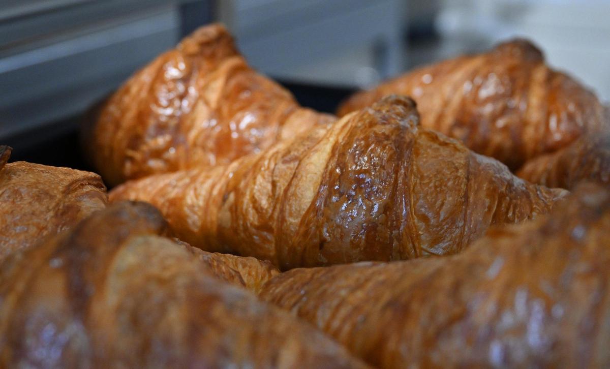 Freshly baked croissants are on trays at Paris Baguette as staff train and prepare Thursday monrning for the bakery’s soft opening Saturday, March 22 in Fresno’s Villaggio Shopping Center. The French-inspired bakery is part of a chain that will offer unique pastries baked daily as well as salads, sandwiches, coffee drinks and more. Photographed Thursday, March 20, 2025 in Fresno.