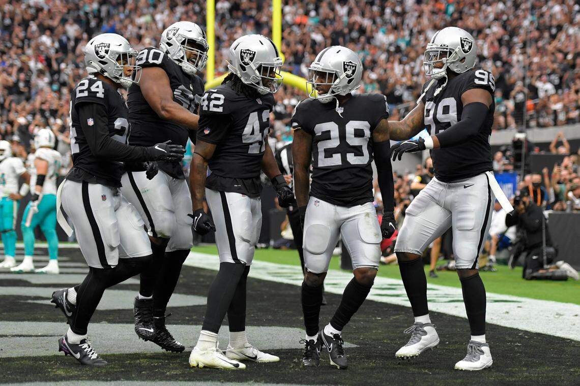 Las Vegas Raiders celebrate after cornerback Casey Hayward (29) made a tackle for a safety against the Miami Dolphins during the first half of an NFL football game, Sunday, Sept. 26, 2021, in Las Vegas.