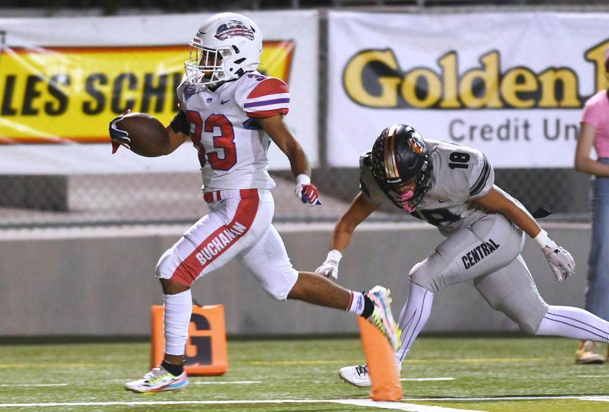 Buchanan’s Michael Runnels, left, scores one of his five touchdowns with Central’s Braylen Hall chasing Friday, Oct. 7, 2022 in Fresno. Buchanan won 49-41.