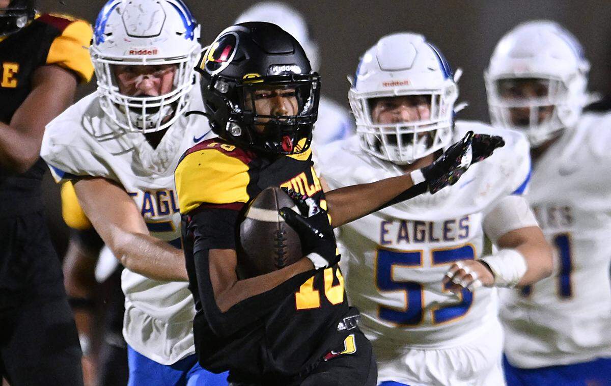 Tulare Union's Jaylon King runs after recovering a Bakersfield Christian fumble Friday, Sept. 26, 2025 in Tulare. Bakersfield Christian beat Tulare Union 30-7.
