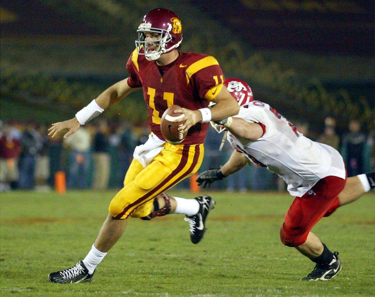 USC's Matt Leinart avoids Fresno State's Garrett McIntyre during their game at the Los Angeles Memorial Coliseum on Saturday night November 19, 2005