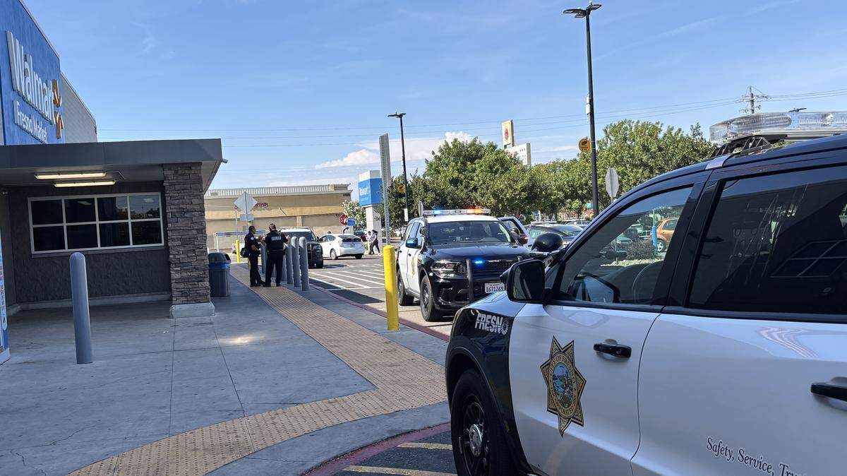 Officers with the Fresno Police Department respond to the Walmart at Cedar and Shields after two individuals ran into the store following a stabbing on Sunday, May 24, 2026.