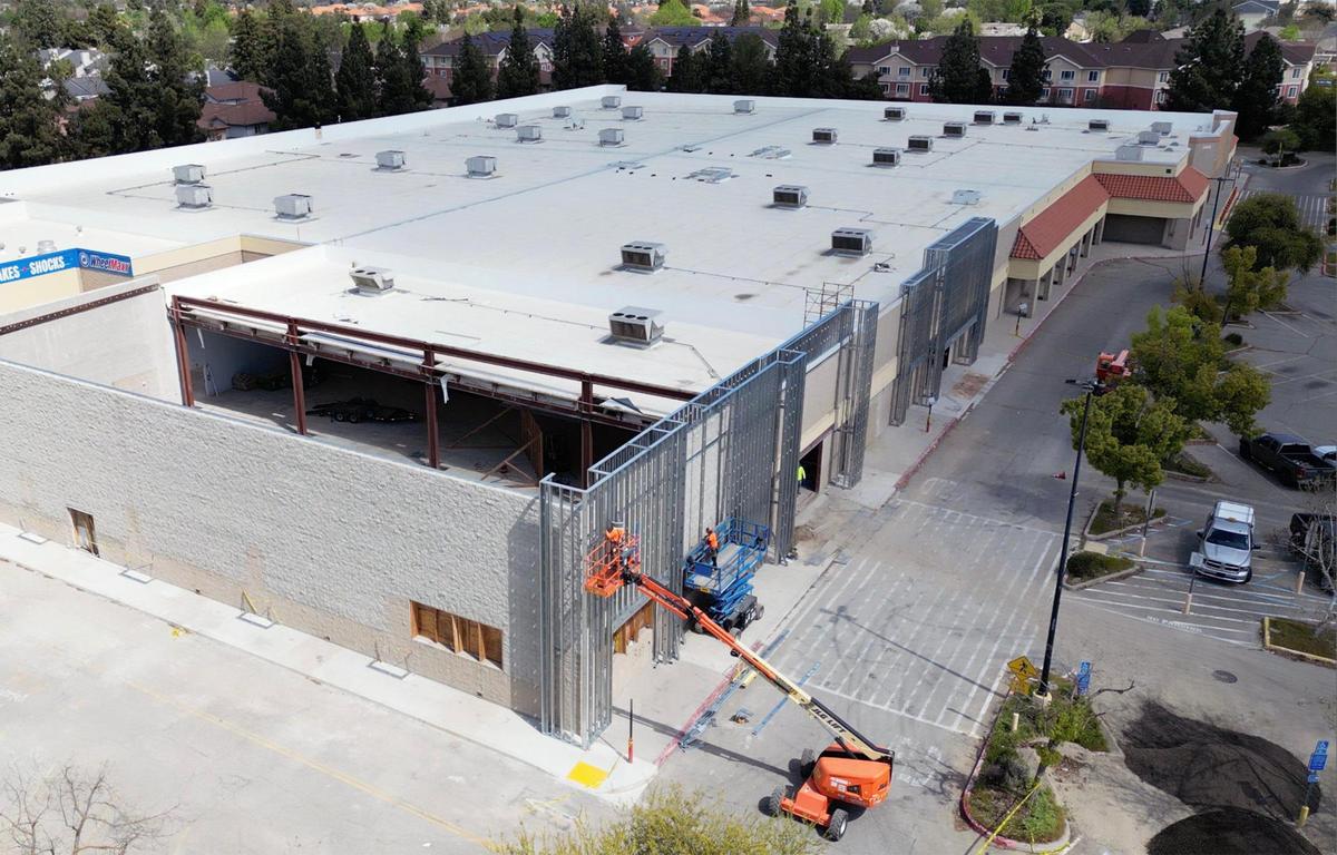 Two new businesses have signed a lease for the former Walmart on West Shaw Avenue as construction workers work on the sprawling structure near Brawley Ave. in Fresno.
