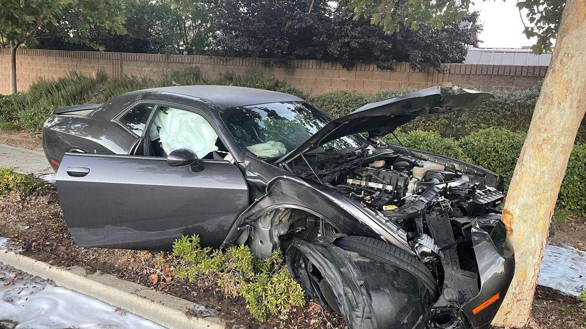 Police say a 15-year-old driver lost control of a high-performance Dodge Challenger and crashed into a tree in southeast Fresno Wednesday night.