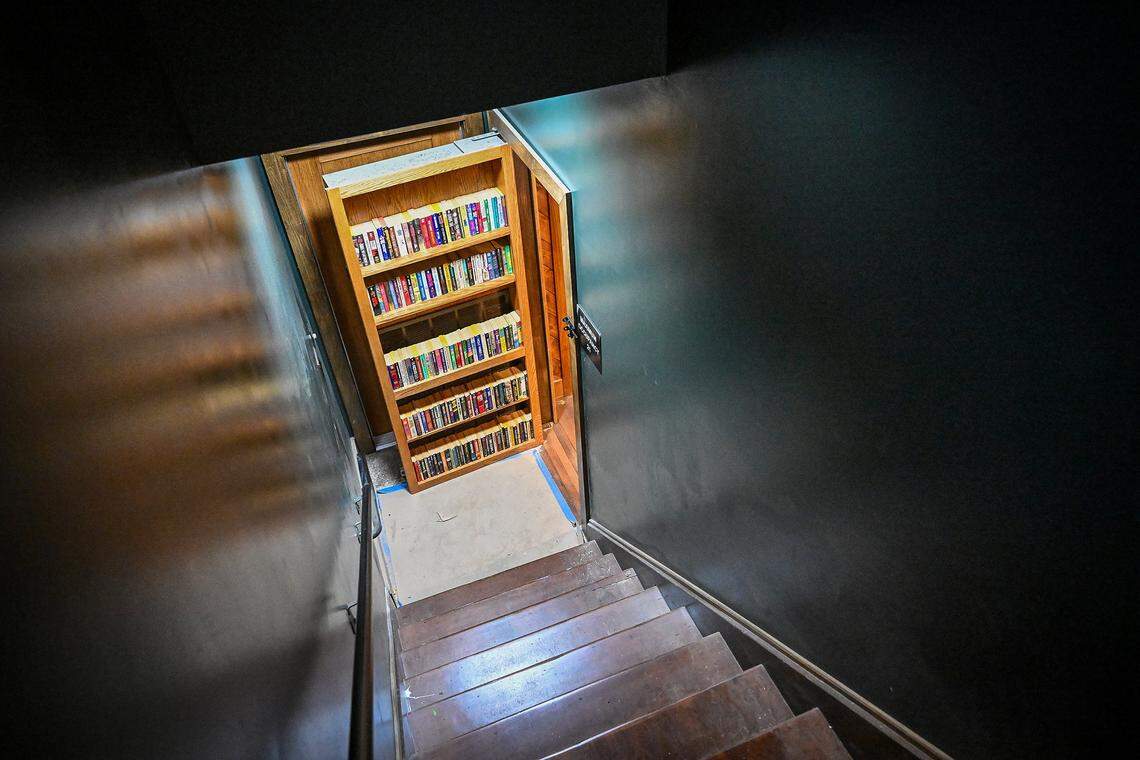 A speakeasy-style secret bookcase door leads to the upstairs at Moses McQueen’s, a new bar created by five Fresno friends in downtown Fresno.