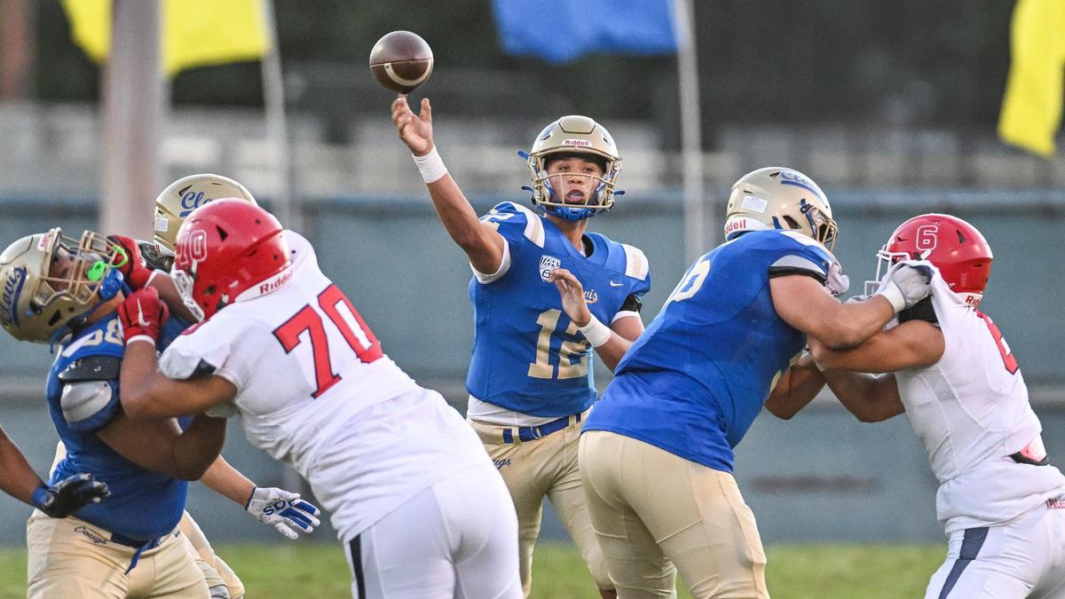 Clovis quarterback Deagan Rose, center, throws down the middle during their game against Sanger at Lamonica Stadium in Clovis on Friday, Aug. 25, 2023.