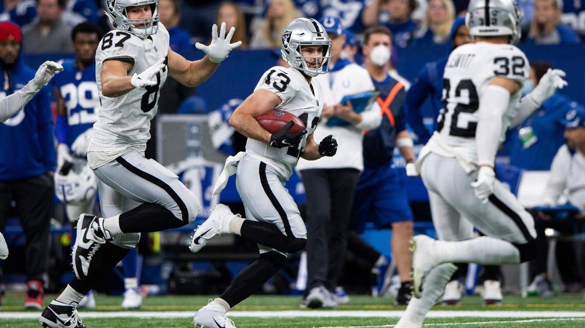 Las Vegas Raiders tight end Foster Moreau blocks for Las Vegas Raiders wide receiver Hunter Renfrow as he runs down the sidelines during an NFL game against the Indianapolis Colts, Sunday, Jan. 2, 2022, in Indianapolis.