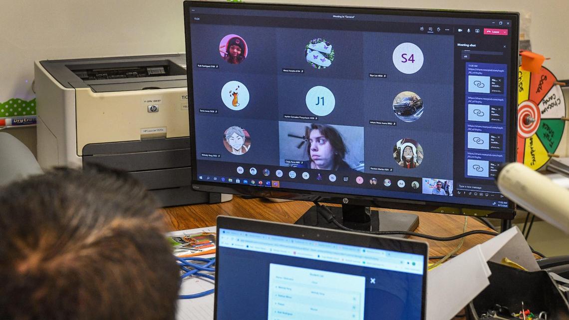 Mostly chat icons reresenting students pop up on Robert Vasquez’s video monitor as he teaches math via online distance video due to coronavirus restrictions at Tioga Middle School in Fresno on Thursday, Sept. 17, 2020.