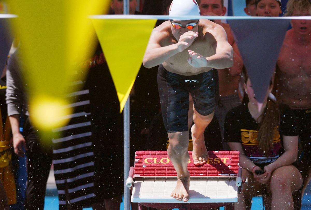 A Clovis West swimmer begins his leg of the Boys 200 Yard Freestyle Relay at the Clovis West Invitational Saturday, April 15, 2023 in Fresno.