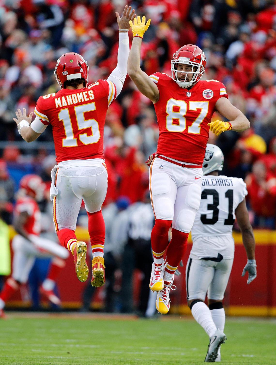 Kansas City Chiefs quarterback Patrick Mahomes (15) celebrates with tight end Travis Kelce (87) after throwing a 67-yard touchdown pass to Tyreek Hill in a victory over the Oakland Raiders in Kansas City, Mo., Sunday, Dec. 30, 2018.