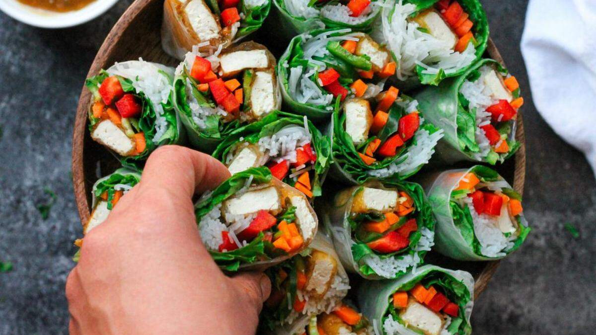 The only cooking these pineapple glazed tofu summer rolls require is frying of the tofu on the stovetop for a summertime meal. 