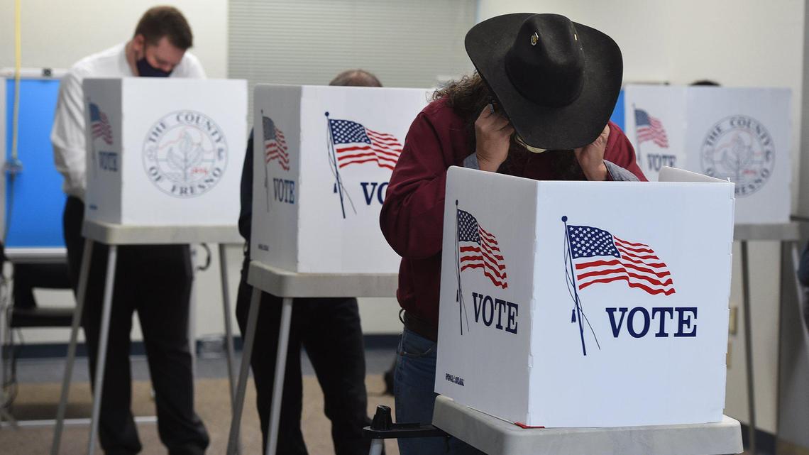 Voters cast their ballots in person at the Fresno County Elections Office on Kern Street, Tuesday Nov. 3, 2020.