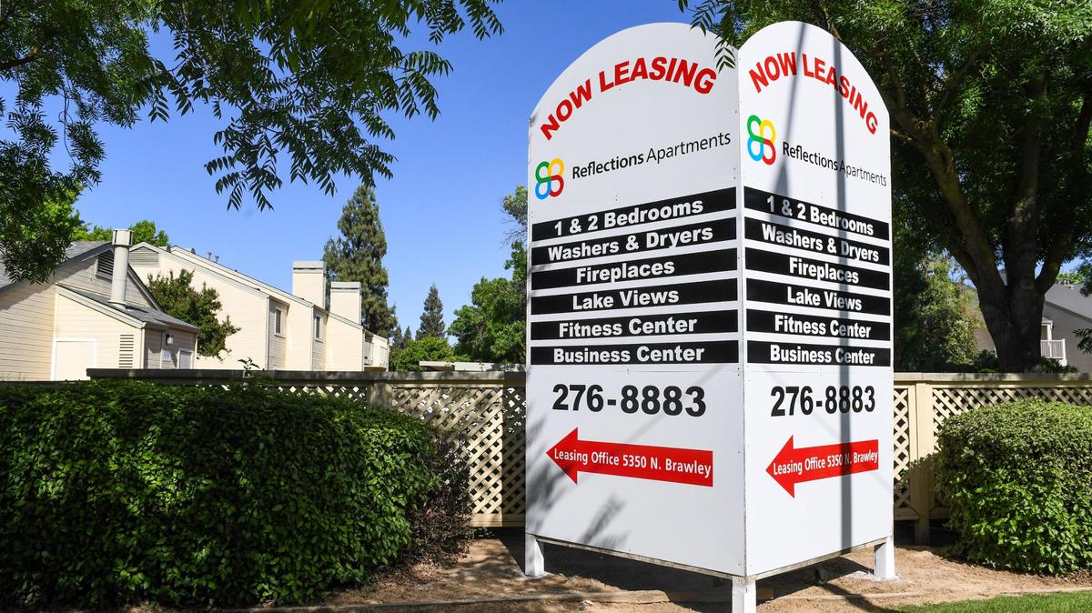 Reflections Apartment Homes on Brawley Avenue in northwest Fresno has several signs advertising units are now leasing on Friday, May 7, 2021.