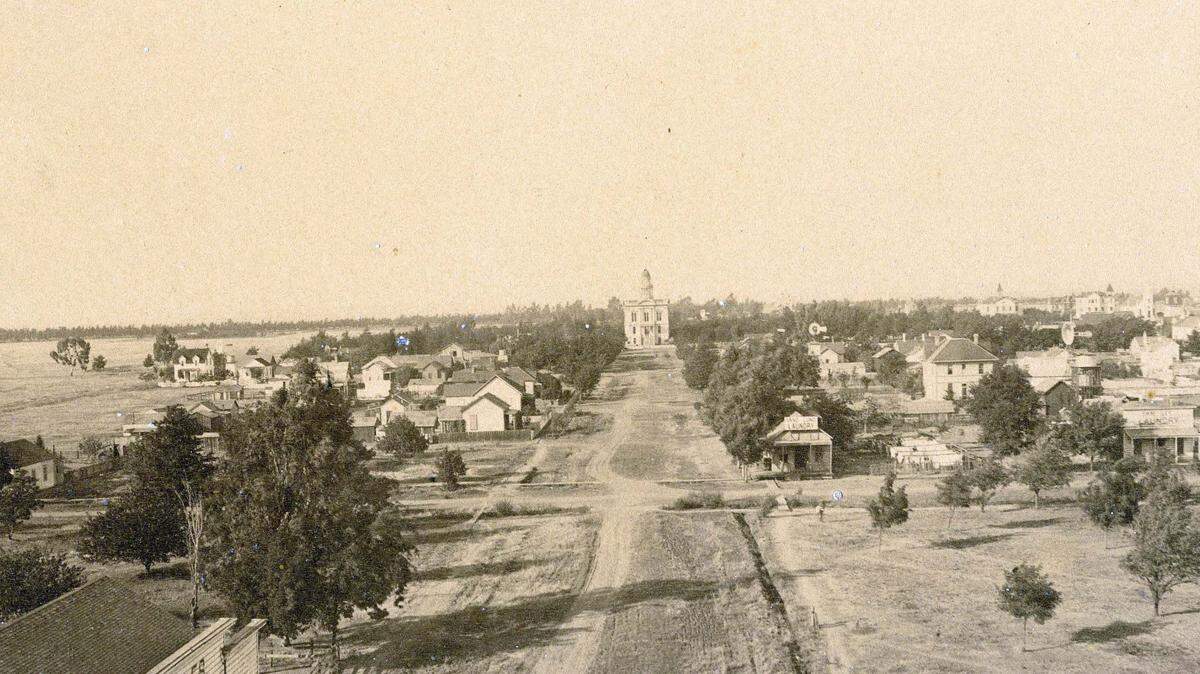 Looking down from El Capitan Hotel on N Street, Courthouse Park is seen in the background. Notice how little development it is on the land west of Courthouse Park in this 1889 photo.