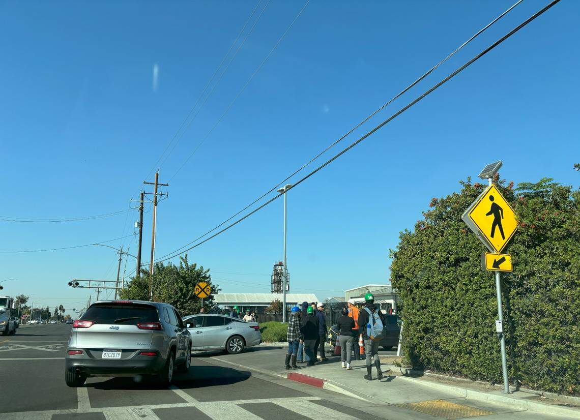 Pitman Farms workers gathered outside the poultry processing plant’s main entrance on Nov. 4, 2024. Sanger Fire Department responded to an ammonia leak at the plant on Monday morning.