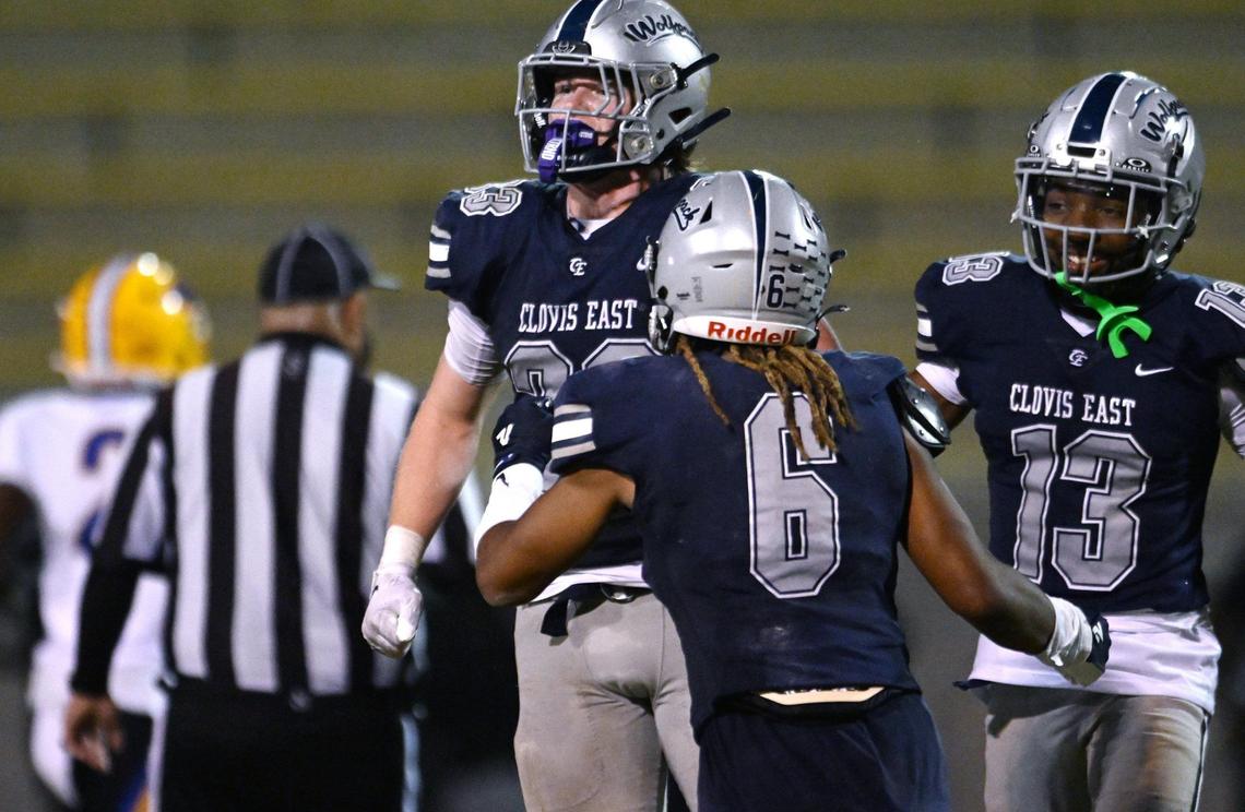 Clovis East’s Jax Koontz, left, celebrates his interception against Grant Union Friday, Sept. 13, 2024 in Clovis.
