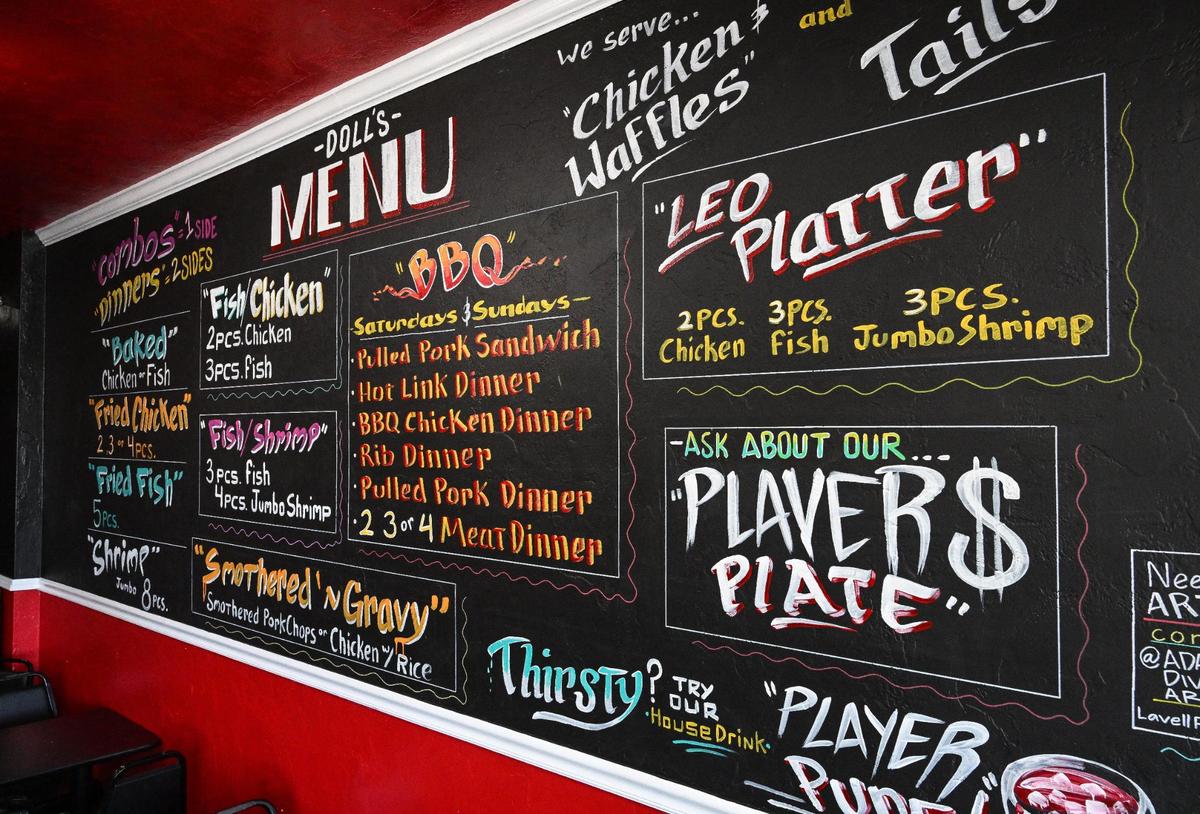 A wall mural lists out the menu items at Doll’s Kitchen in Fresno, which recently opened up in the shopping center southwest of the intersection of Shaw and Blackstone in Fresno.