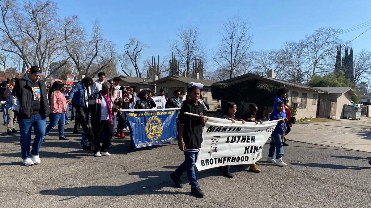Marchers are shown participating in Merced’s MLK Parade on Feb. 18, 2023.