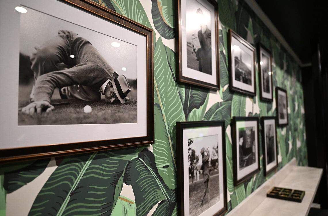 Framed black and white photographs adorn the walls of the golf simulator room, seen during a tour inside the new PM Lounge, Wednesday, Feb. 18, 2026 in Fresno.