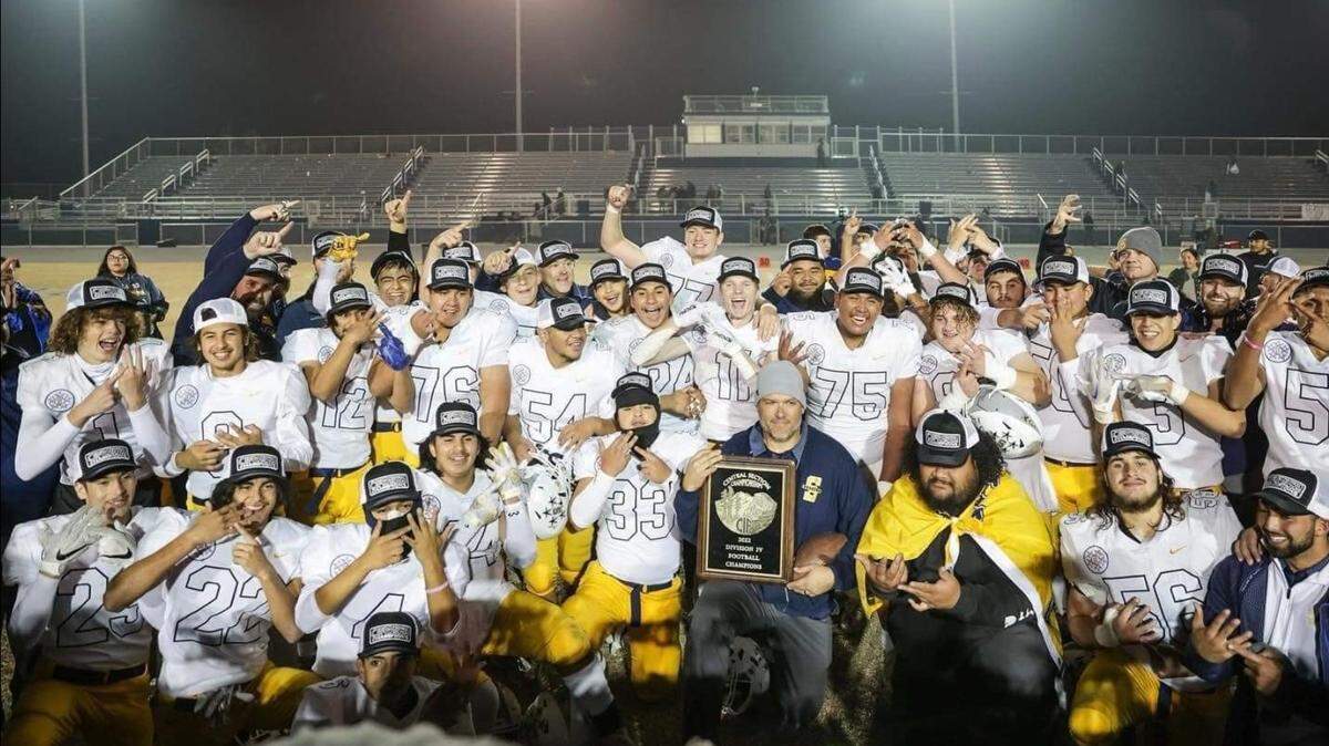 Shafter High coaches and players celebrate after winning the Central Section championship.