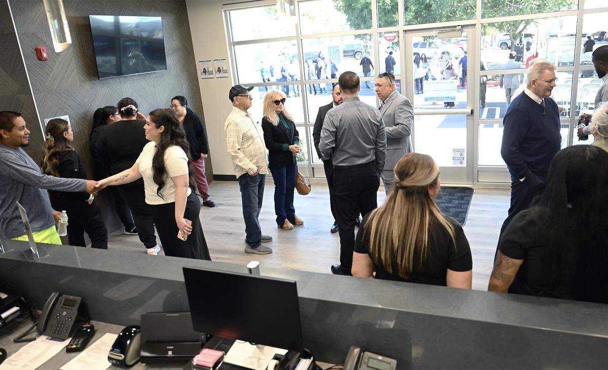 Visitors tour United Health Centers' new Fresno Cesar Chavez Health Center during its grand opening Friday morning, Oct. 23, 2025 in west Fresno.