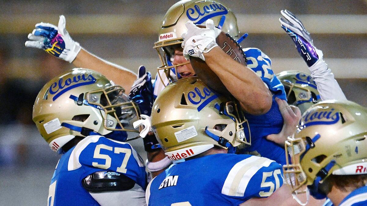 Clovis High’s Maddox Merrill, top, is lifted in celebration after he scored a touchdown against Bullard making it 25-0 in the second quarter Friday night, Sept. 20, 2024 at Lamonica Stadium in Clovis.