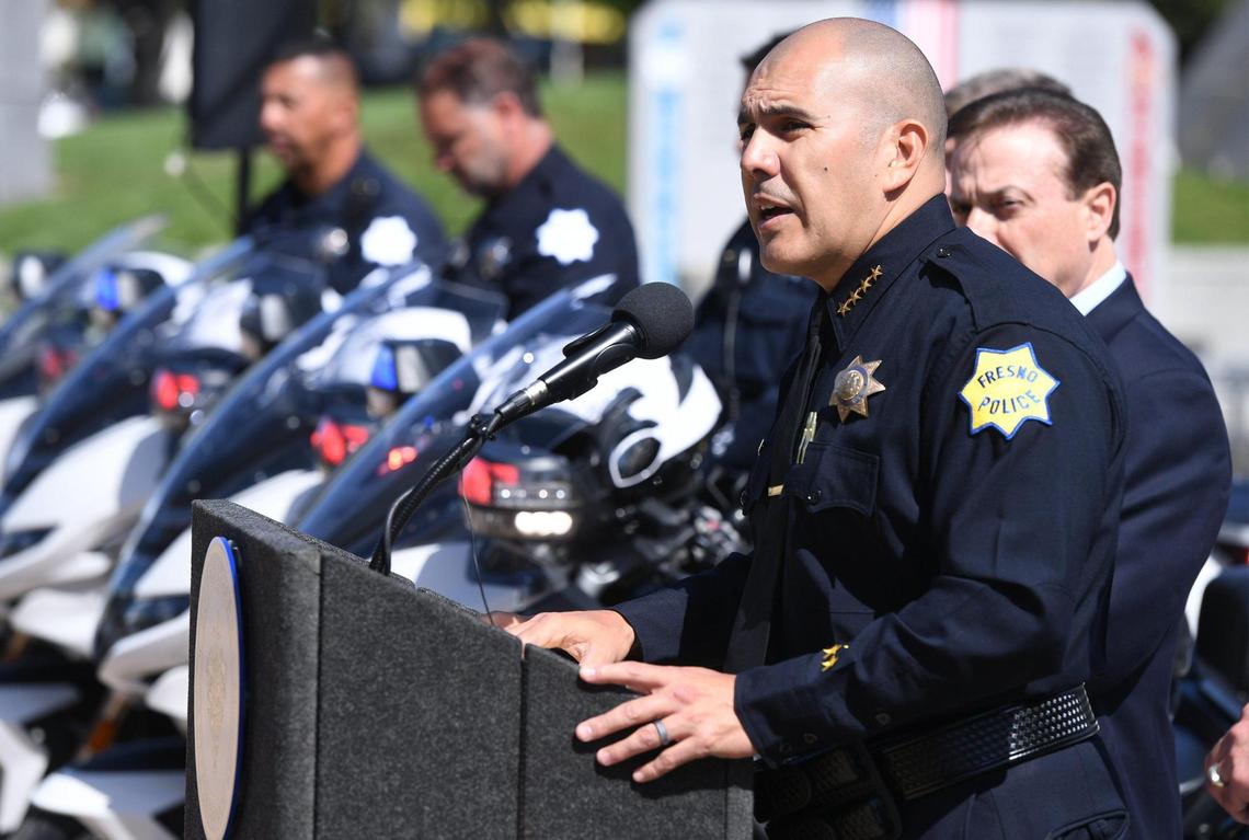 Fresno Chief of Police Paco Balderrama, right, announces a proposed ordinance that will go before the city council which would fine those who attend and watch as well as participate in any sideshow in the city, during a press conference in front of Fresno City Hall Wednesday, April 19, 2023 in Fresno.