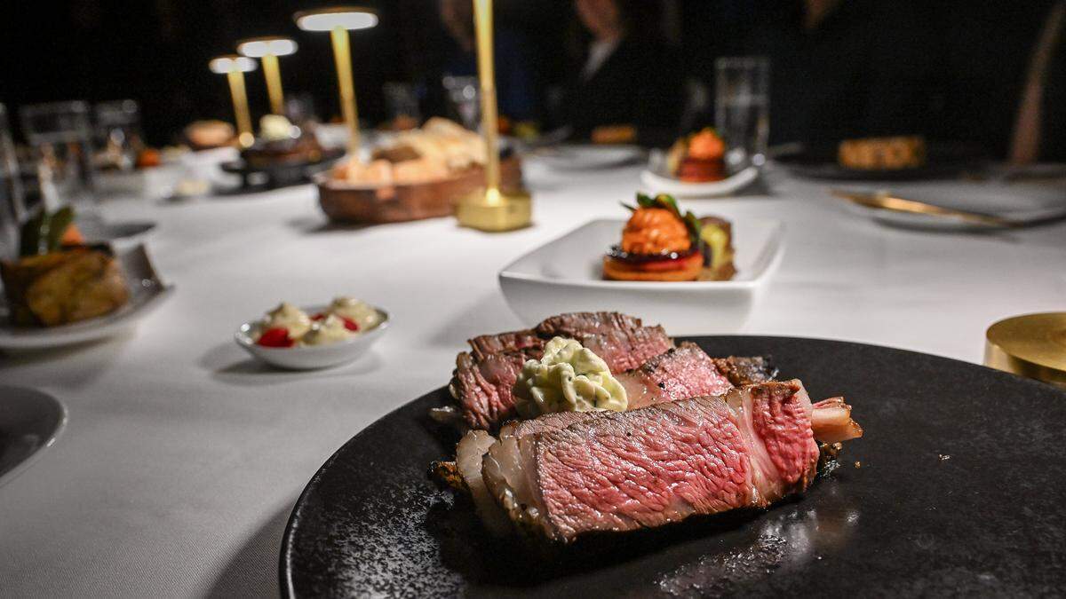 Slices of a tomahawk ribeye steak are served during a media event to promote The PM Lounge, a new members-only club that promises to bring high-level dining experiences and live entertainment to its guests.