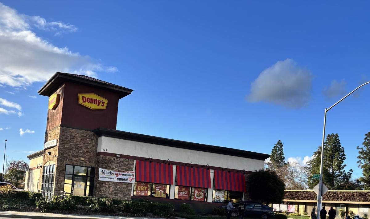 A vehicle ended up on the side of Denny’s following a collision with another car in Fresno, California at Clovis Avenue, near Cesar Chavez Boulevard on Friday, Dec. 26, 2025.