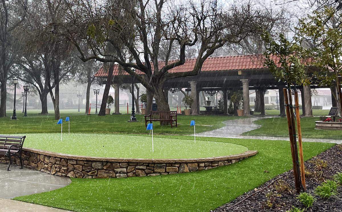 Hail falls on the putting green on the north side of The Vineyards, the independent living unit of the California Armenian Home on Saturday afternoon, March 11, 2023, east of Fresno. The photograph was taken by The Vineyards resident Fran Shellenberger on an afternoon walk around 4:30 p.m.
