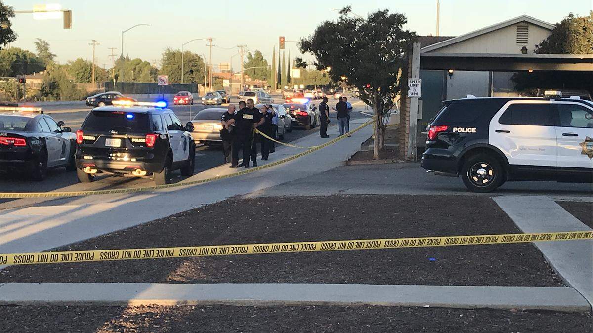 Fresno police on Shields Avenue just east of Highway 168, near where two people were shot early Tuesday morning, Sept. 18, 2018.