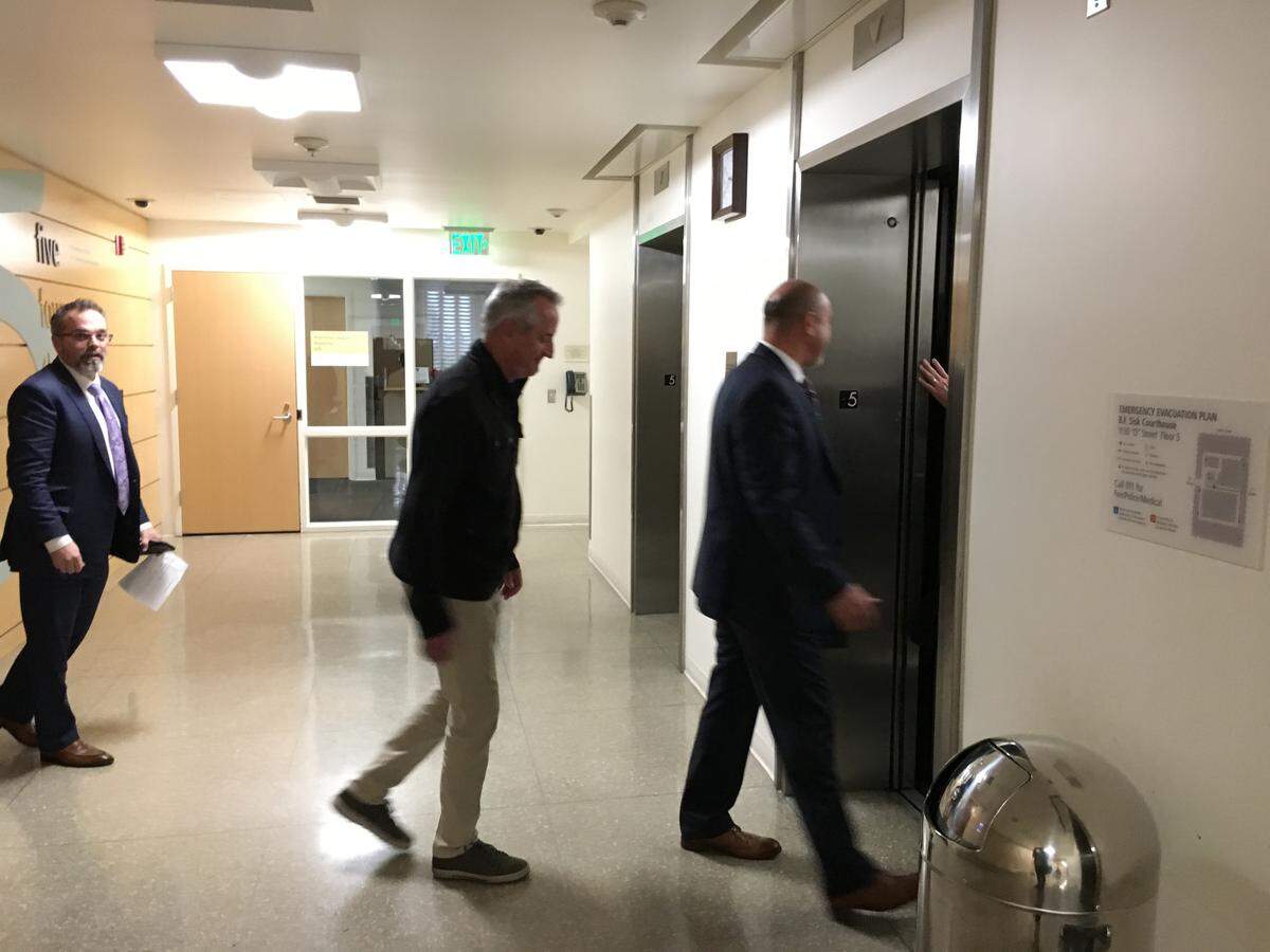 David Bray, middle, walks behind his attorney John Fowler on Wednesday, Feb. 20, 2019, after being awarded $209,882 in damages stemming from a lawsuit against Fresno County over a bike accident on Auberry Road in 2017.