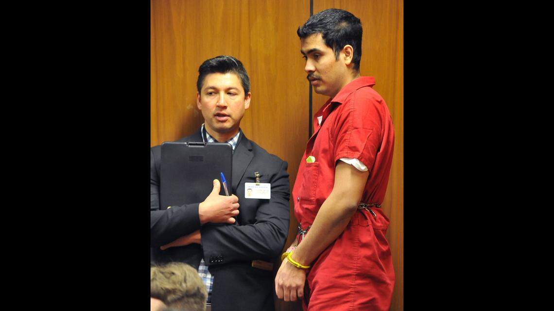 Victor Dominguez-Gomez, right, in Superior Court Department 31, in his pre-preliminary hearing, Wednesday Feb. 21, 2018, on domestic violence homicide of Rocio Medina Gomez. His court-appointed interpreter Jose Astorga at left.