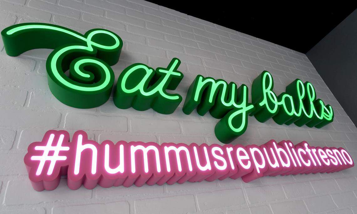 Hummus Republic, at 2424 Tulare Street in downtown Fresno, is a modern Mediterranean restaurant that specializes in falafel and hummus. Its sign is a reference to the round-shaped falafel.