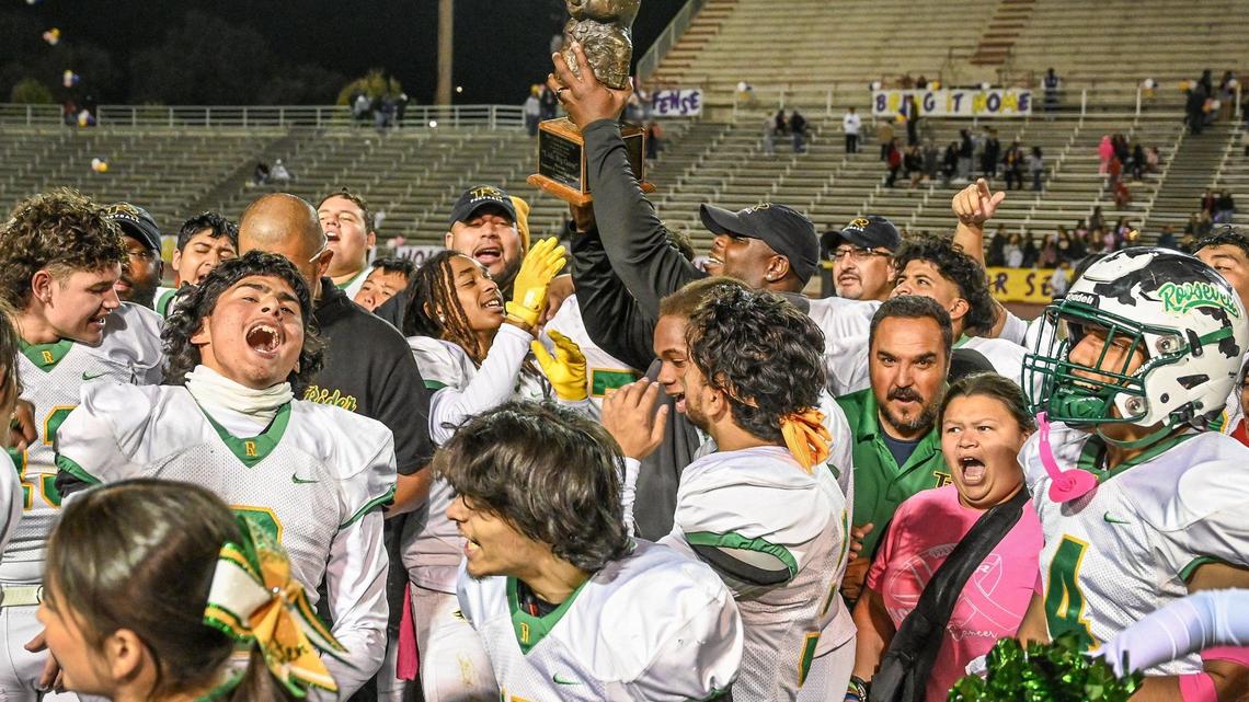 Roosevelt players, coaches and fans celebrate taking Pancho the pig trophy home again after defeating Fresno in the 92nd annual Little Big Game between the two schools at Ratcliffe Stadium in Fresno on Friday, Oct. 28, 2022.
