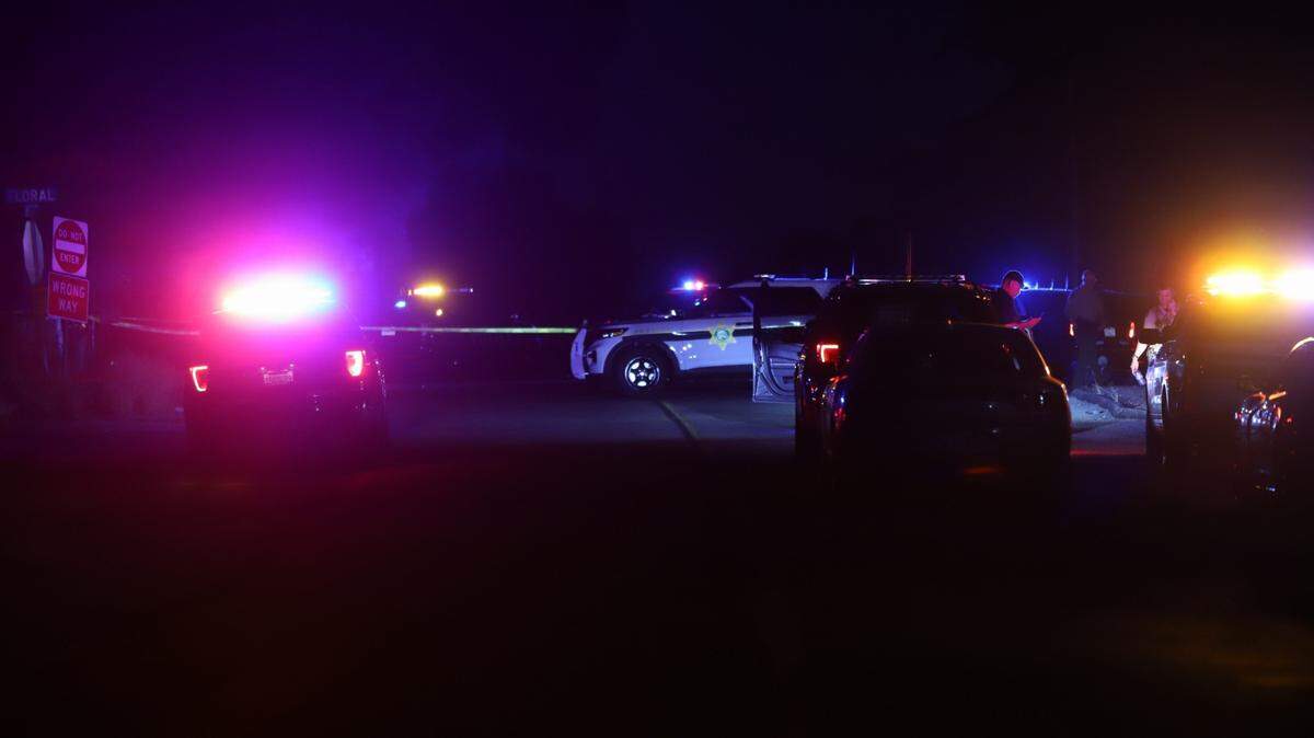 Law enforcement officers on the scene near Reedley on Sunday night.