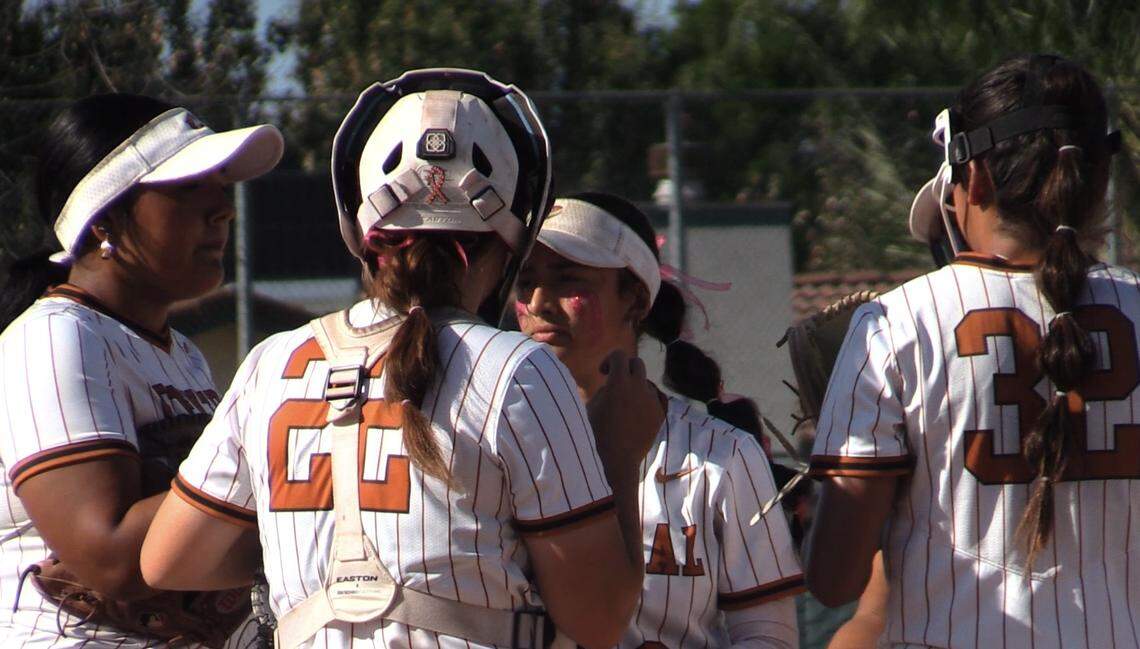 Central talks in the circle in the top of the seventh inning in a Central Section Division I semifinal game against Buchanan.