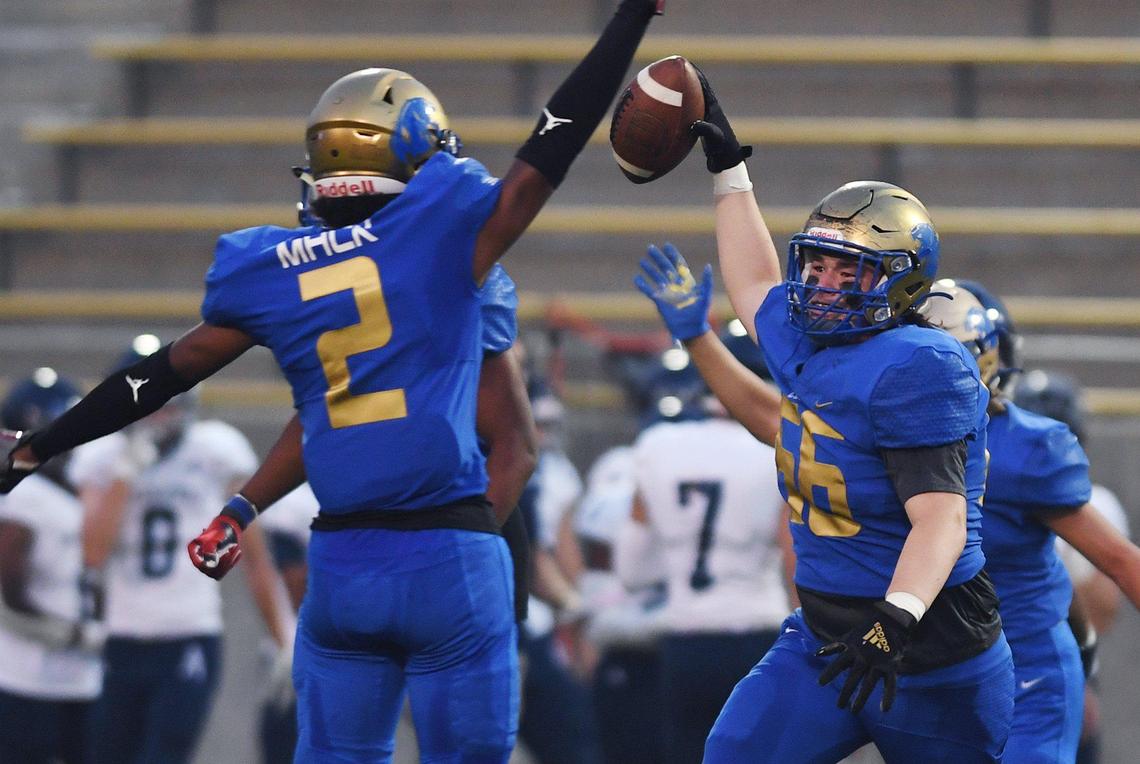 Clovis High recovers a Bakersfield fumble Friday, Aug. 27, 2021 in Clovis.