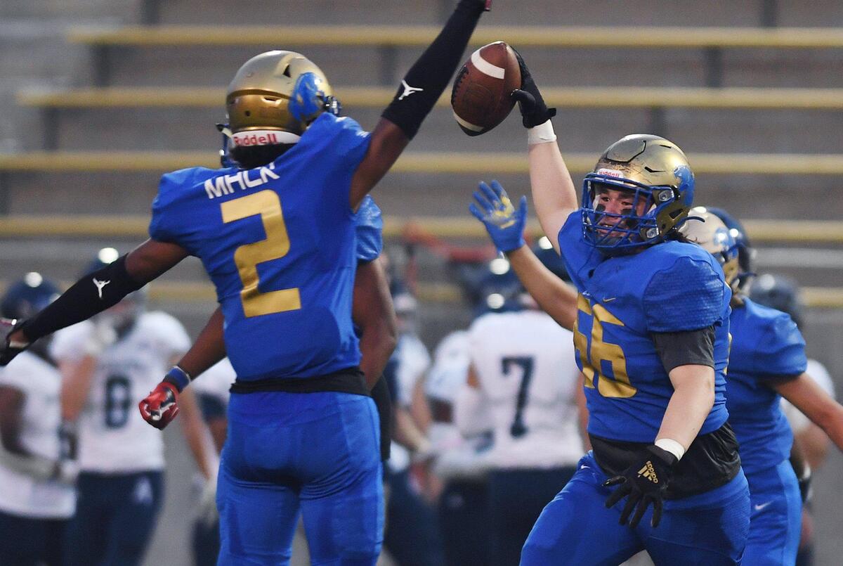 Clovis High recovers a Bakersfield fumble Friday, Aug. 27, 2021 in Clovis.