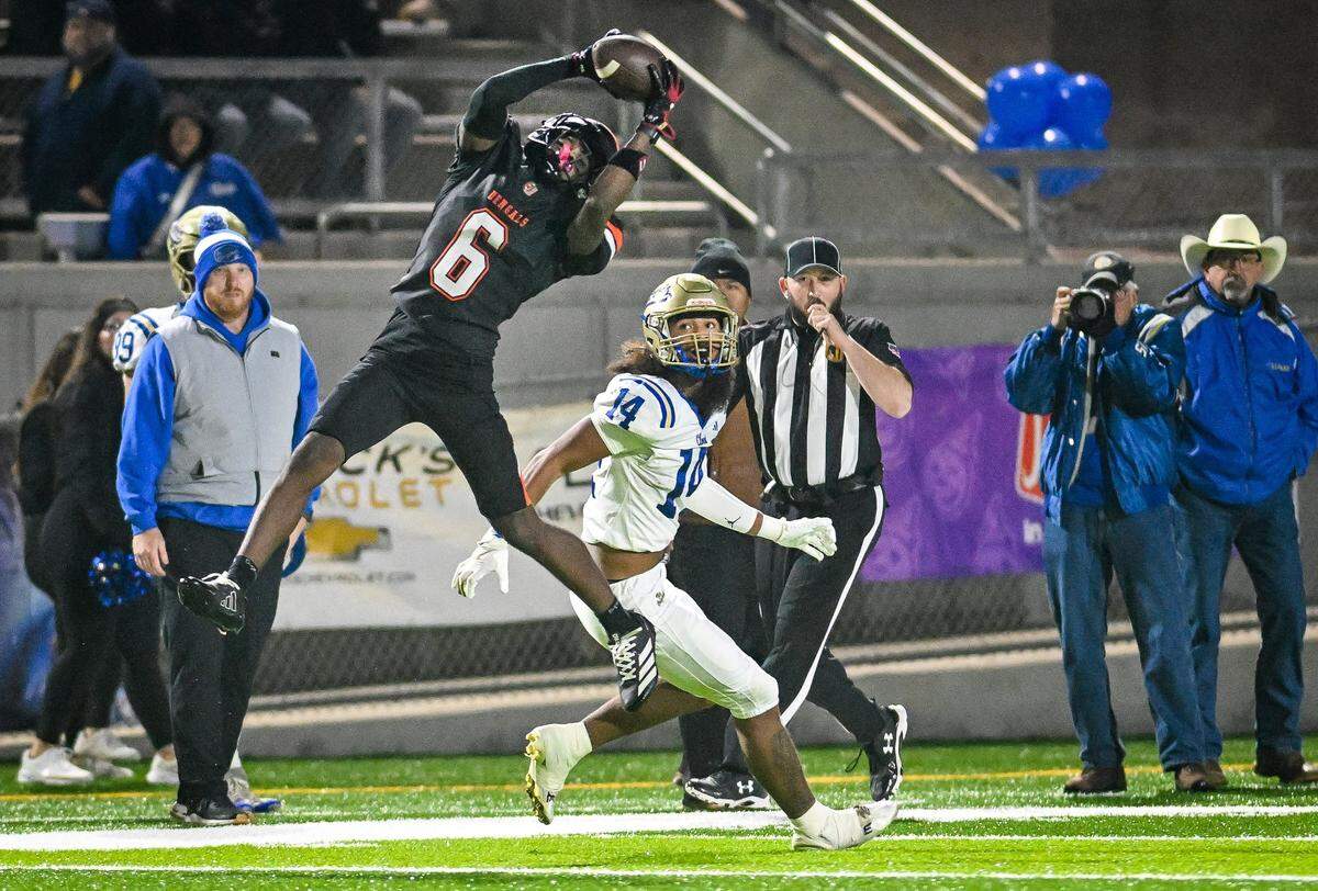 Central East's Jontae Della intercepts a pass intended for Clovis' Israel Briggs during their Central Section Division I-AA championship game at Deran Koligian Stadium on Friday, Nov. 21, 2025.